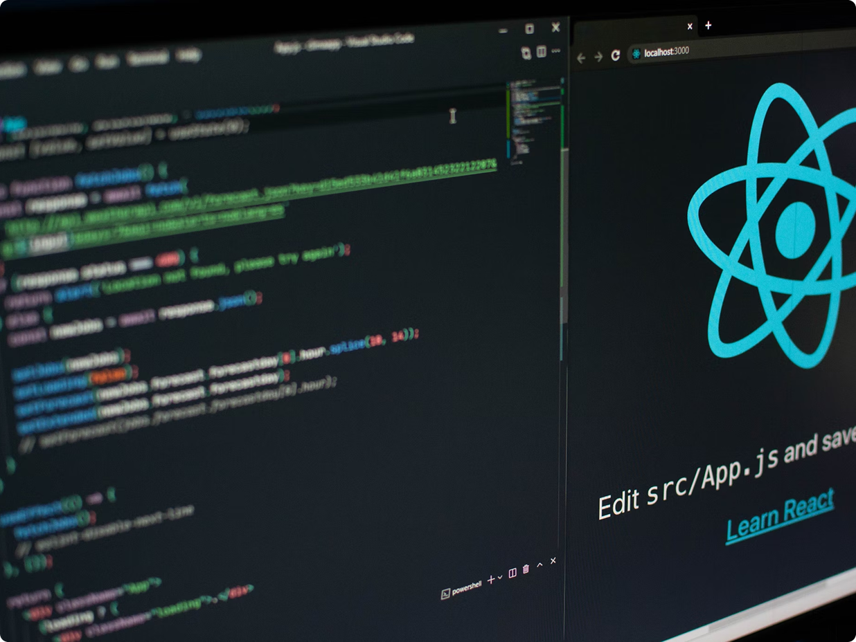 Zoomed in laptop with React code on the screen